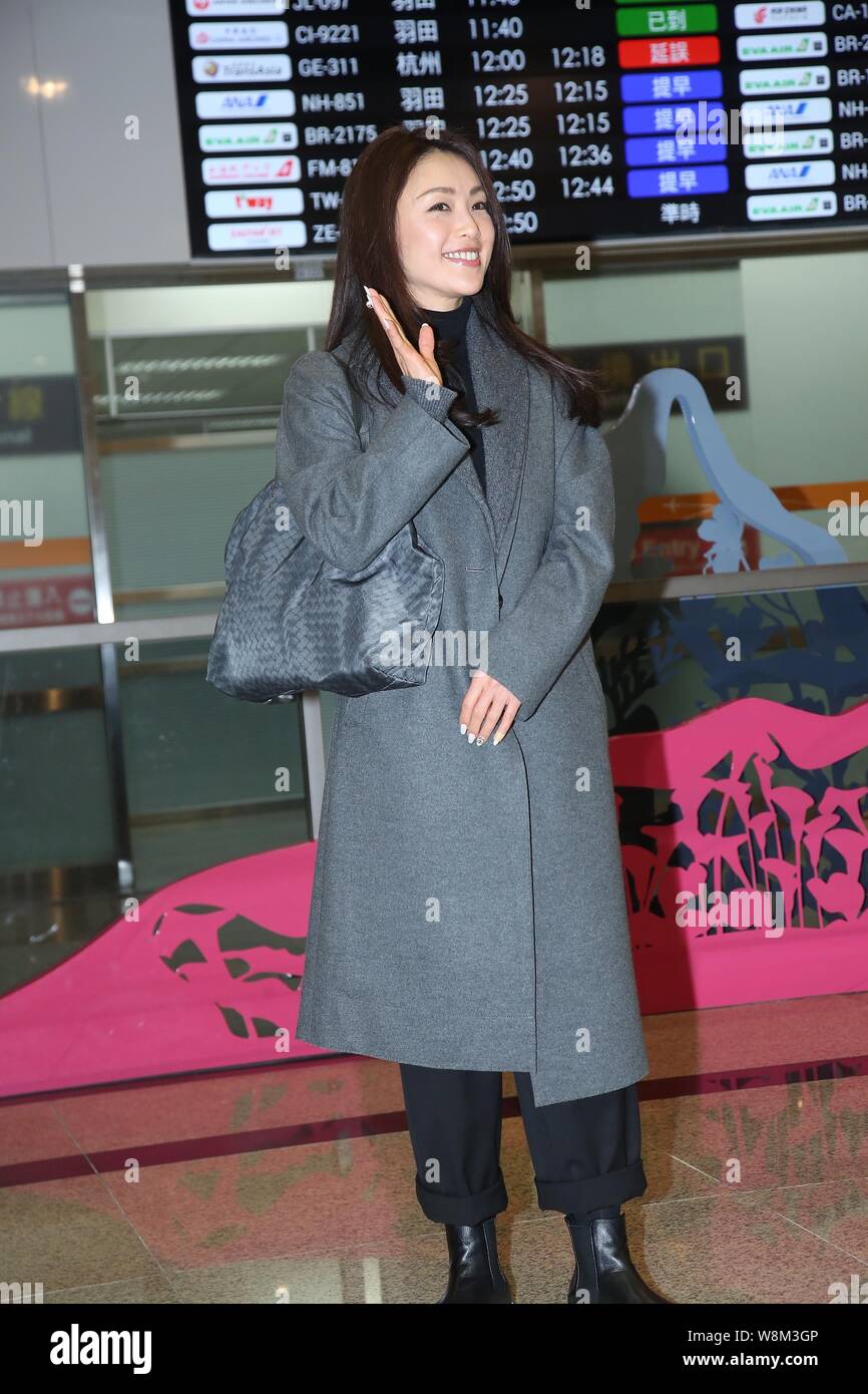 Japanese singer and actress Noriko Sakai is pictured at Taipei Songshan Airport after landing in Taipei, Taiwan, 30 January 2016. Stock Photo