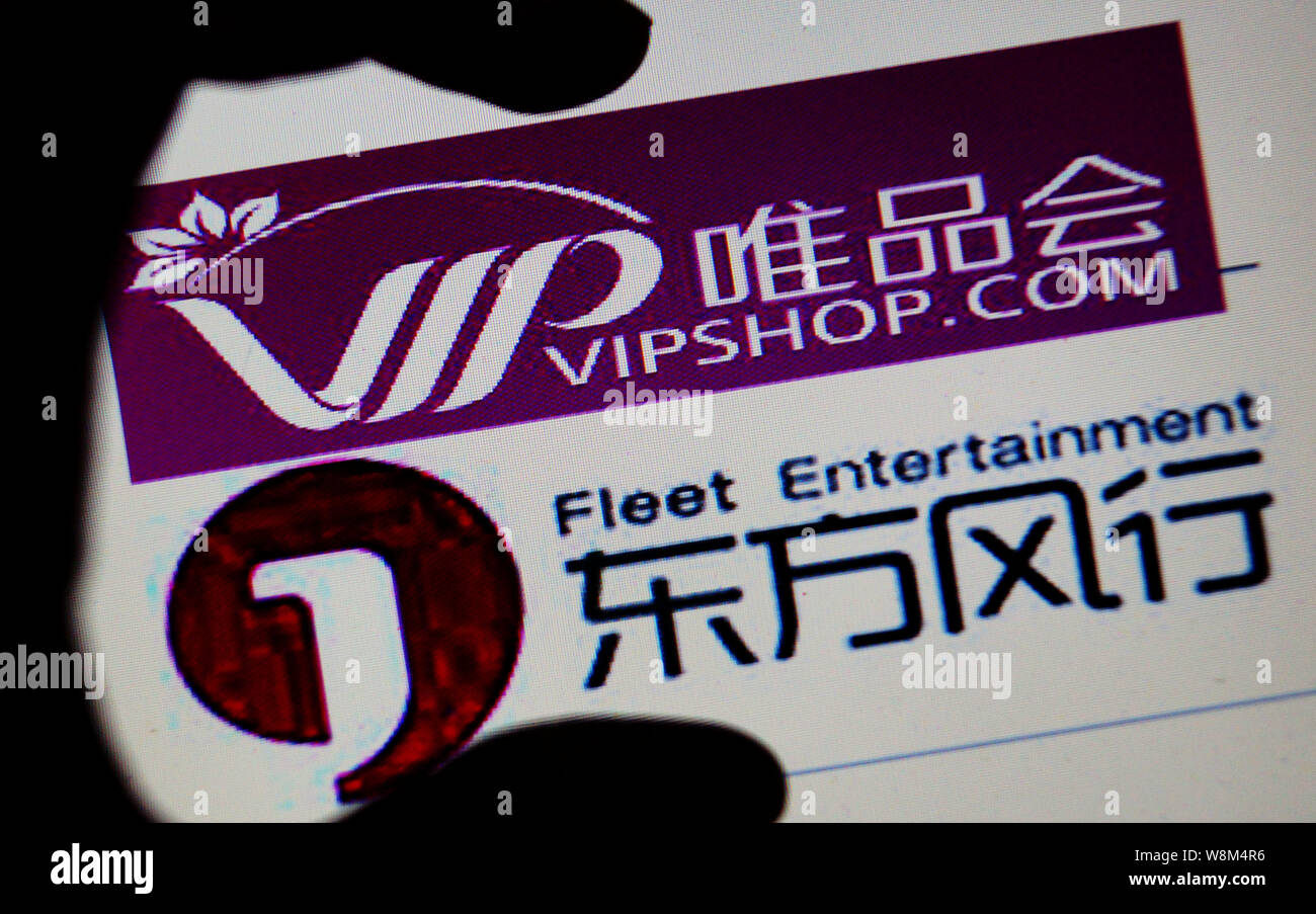 --FILE--A Chinese netizen looks at logos of Vipshop.com and Fleet ...
