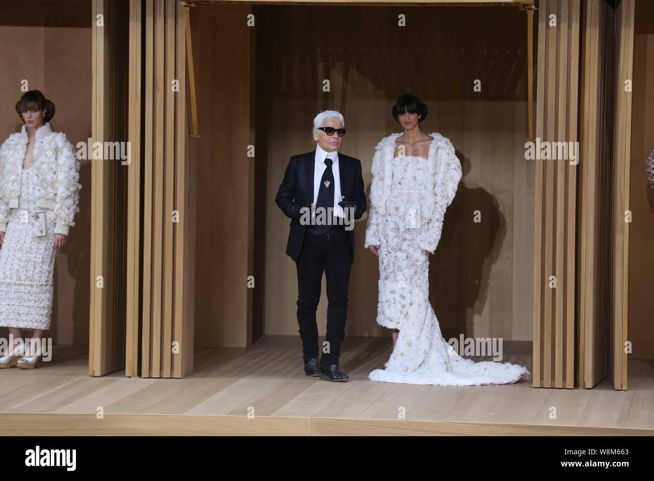 German Fashion Designer Karl Lagerfeld Left Is Pictured At The