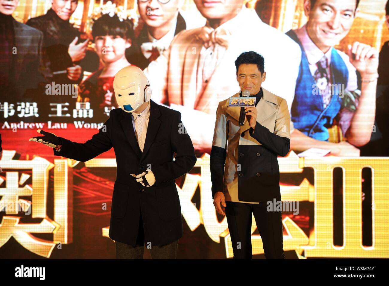 Hong Kong actor Chow Yun-fat, right, and Chinese dubbing actor Chen Hao wearing a mask attend a press conference to promote their new movie 'The Man F Stock Photo