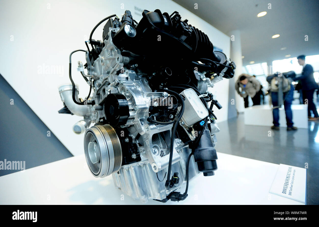 Visitors look at car engines during the opening ceremony of the new engine  plant of BMW Brilliance Automotive (BBA) in Shenyang city, northeast China'  Stock Photo - Alamy