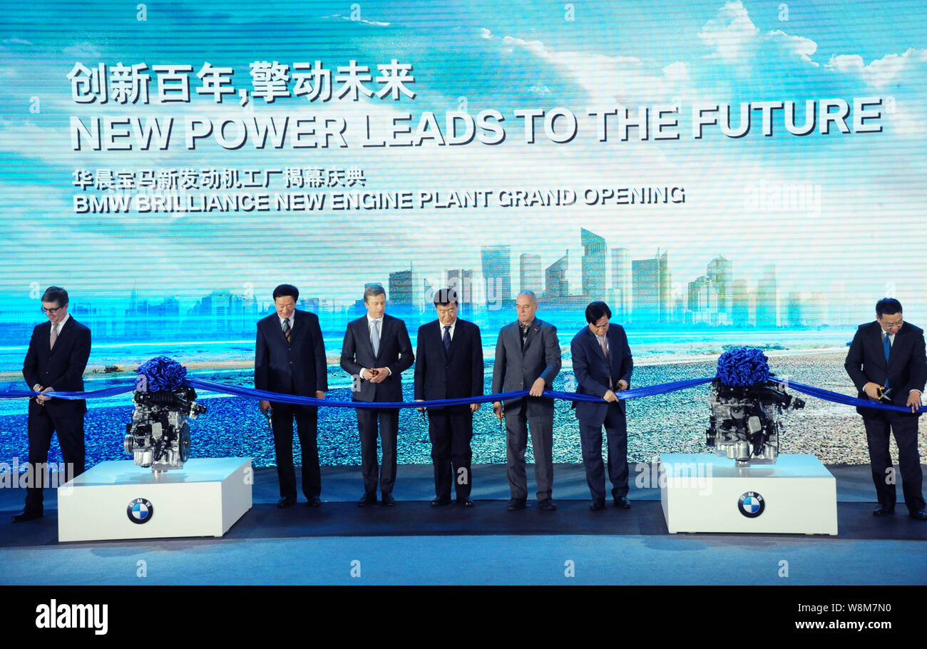 Executives and officials cut the ribbon during the opening ceremony of the new engine plant of BMW Brilliance Automotive (BBA) in Shenyang city, north Stock Photo