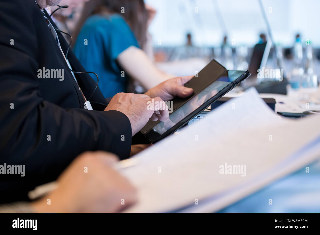 close up shot of business people hands using tablet computer during the ...