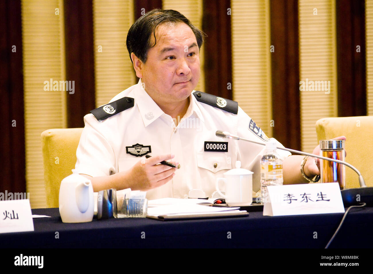 --FILE--Li Dongsheng, then Vice Minister of Public Security of China, attends a meeting in Nanjing city, east China's Jiangsu province, 19 June 2012. Stock Photo