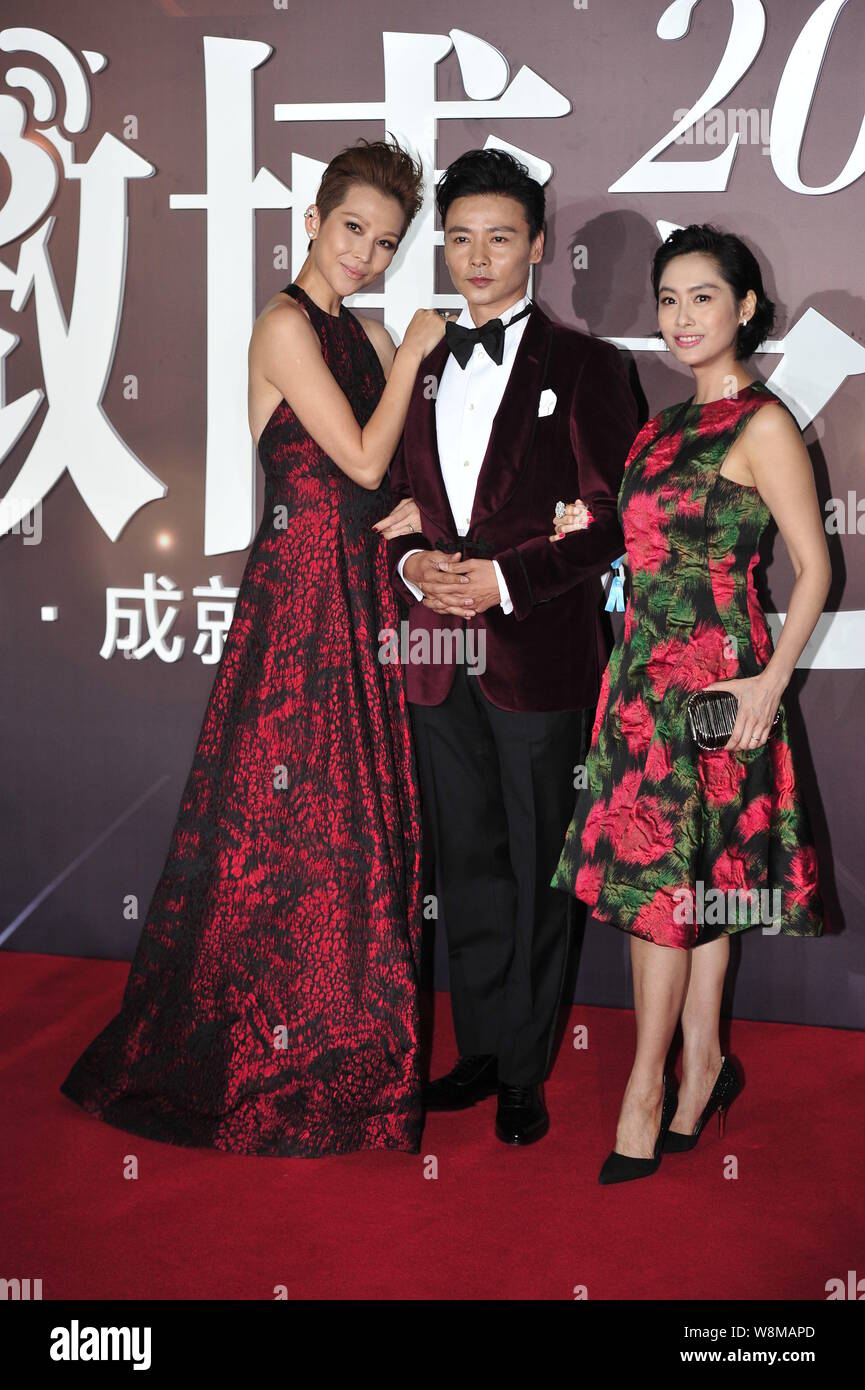 (From left) Hong Kong actress Ada Choi, her Chinese actor husband Zhang Jin and Hong Kong actress Athena Chu arrive on the red carpet for the 2015 Wei Stock Photo