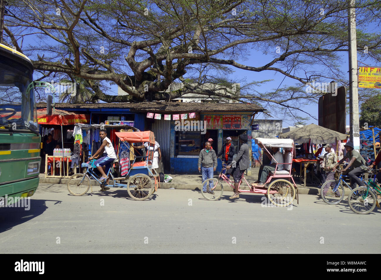 Main street busy with rickshaws and other traffic, Moramanga, Madagascar. No PR or MR Stock Photo