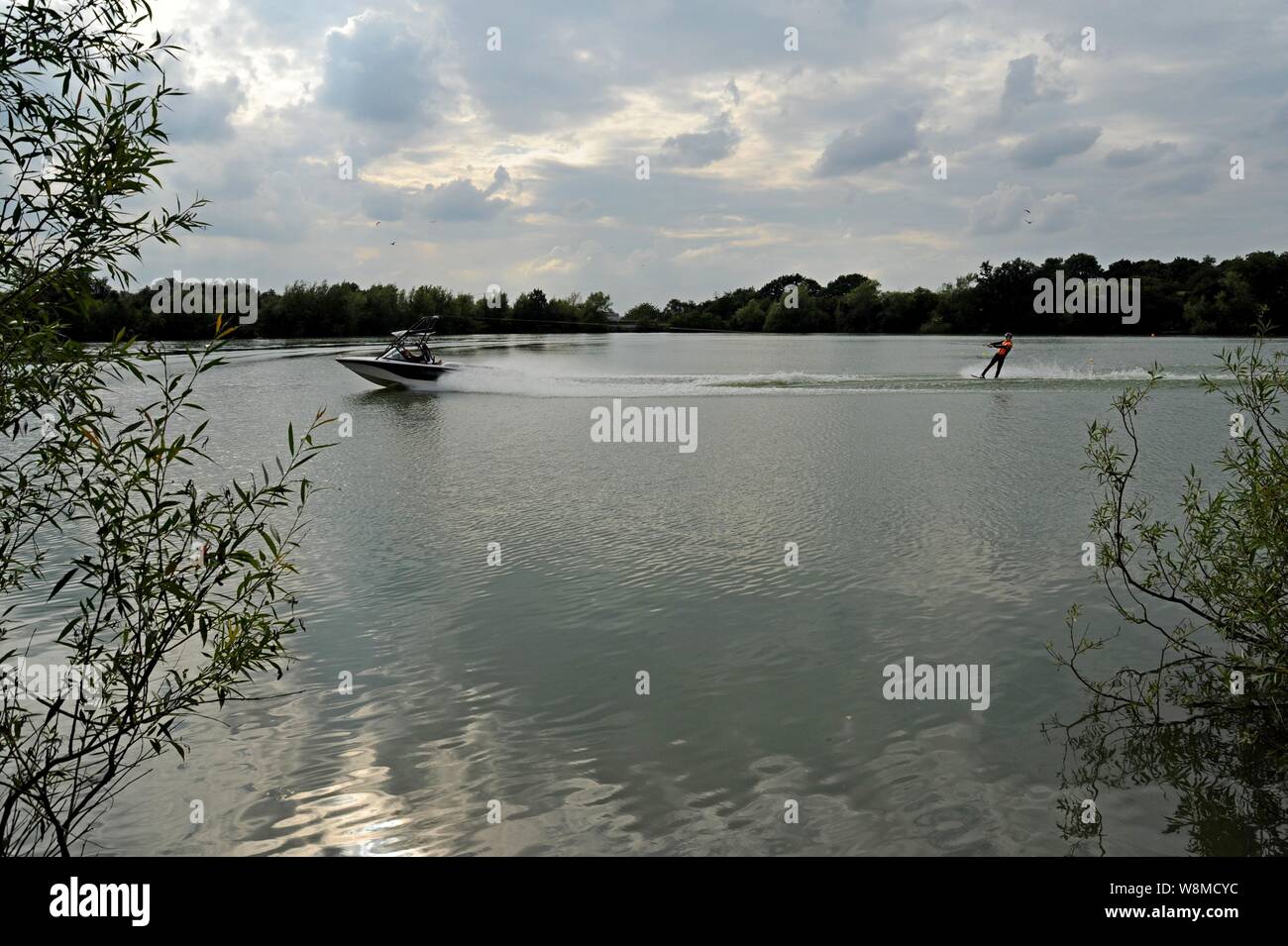 A person water wakeboarding on the Netherton Resevoir, adjacent to the Dudley Canal, Black Country, UK Stock Photo