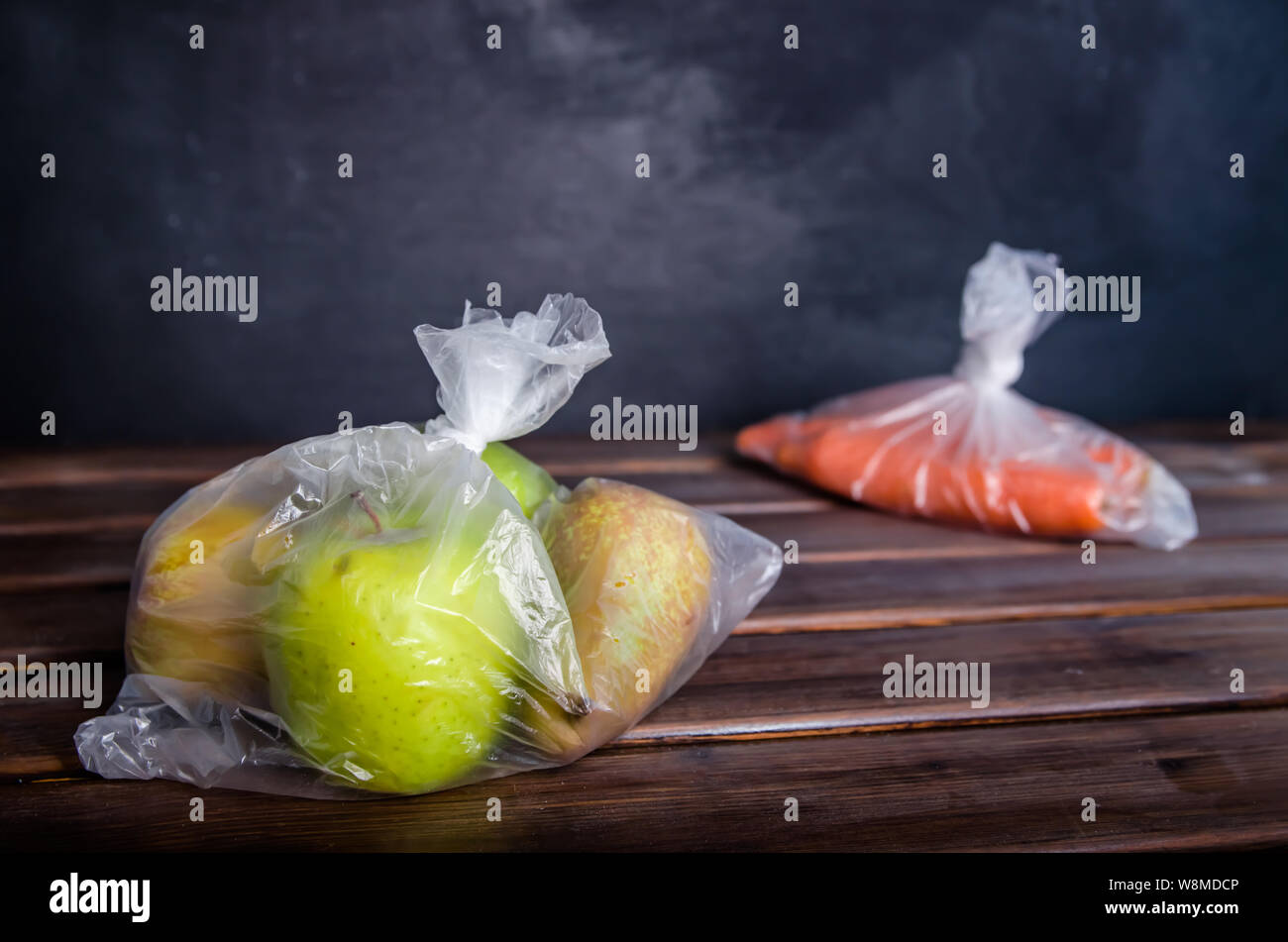 concept plastic free fruits and vegetables in plastic bags on a brown