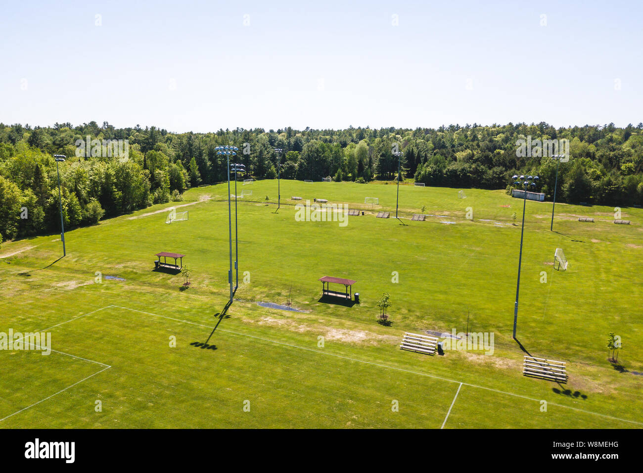 Aerial/Drone view of soccer/football field complex during the afternoon