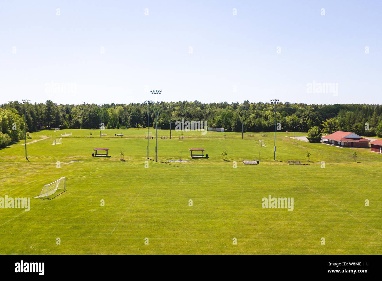 Aerial/Drone view of soccer/football field complex during the afternoon