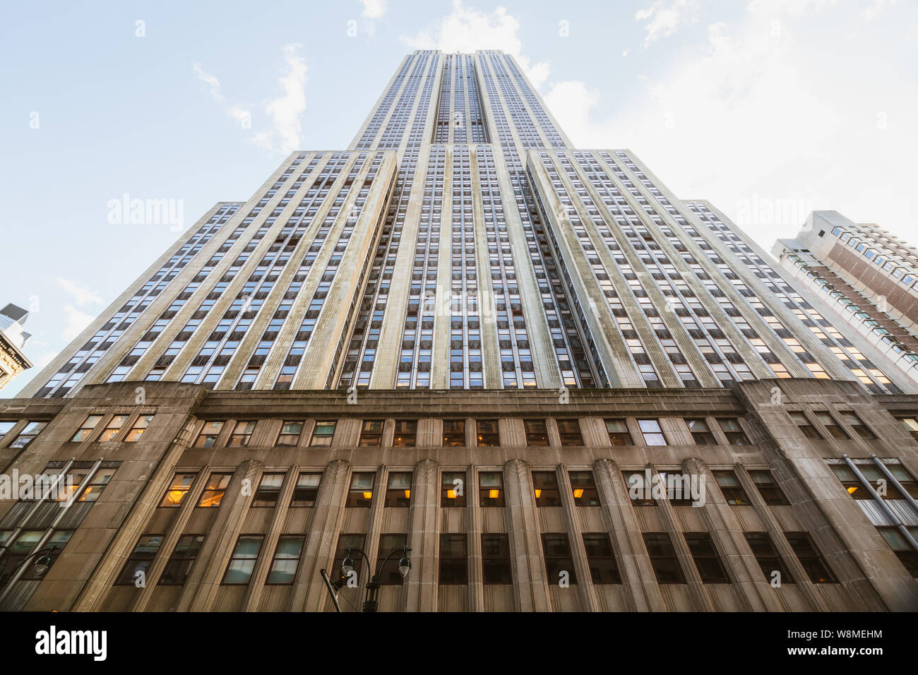 New York City/USA -May 27, 2019 Empire State Building. Low Angle View, Perspective, Blue Sky Background. New York City Historic Landmark. Stock Photo