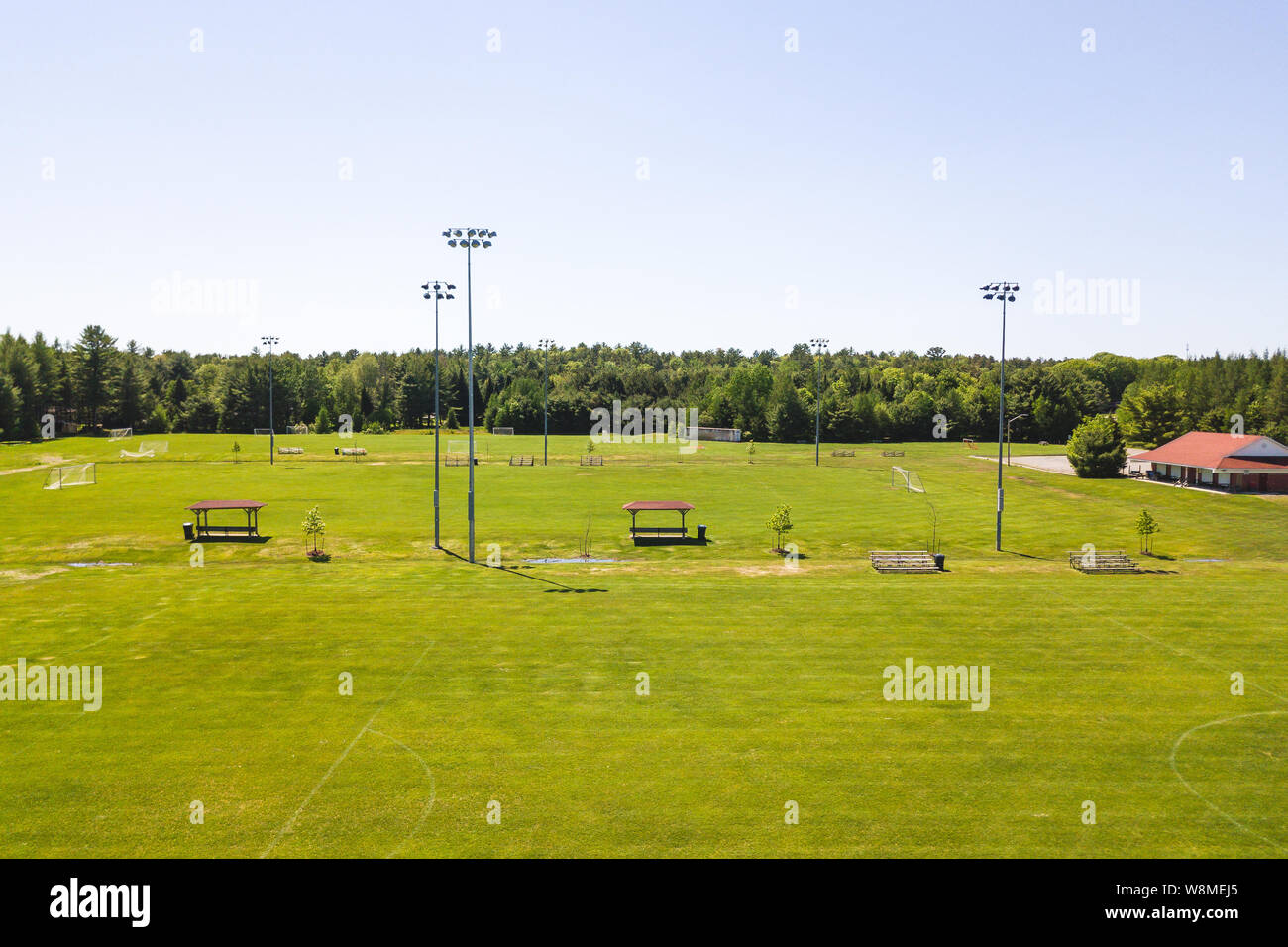 Aerial/Drone view of soccer/football field complex during the afternoon
