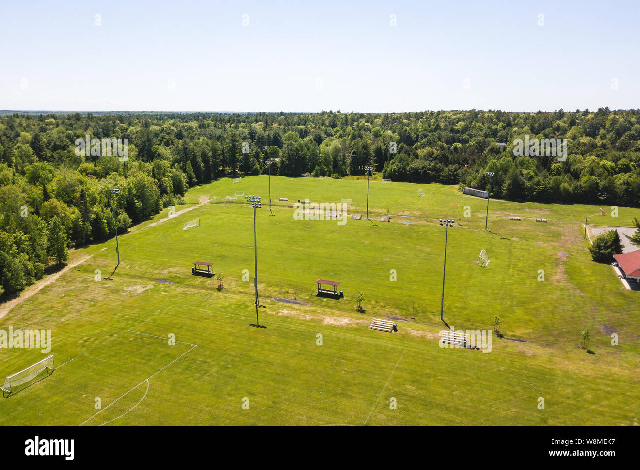 Aerial/Drone view of soccer/football field complex during the afternoon