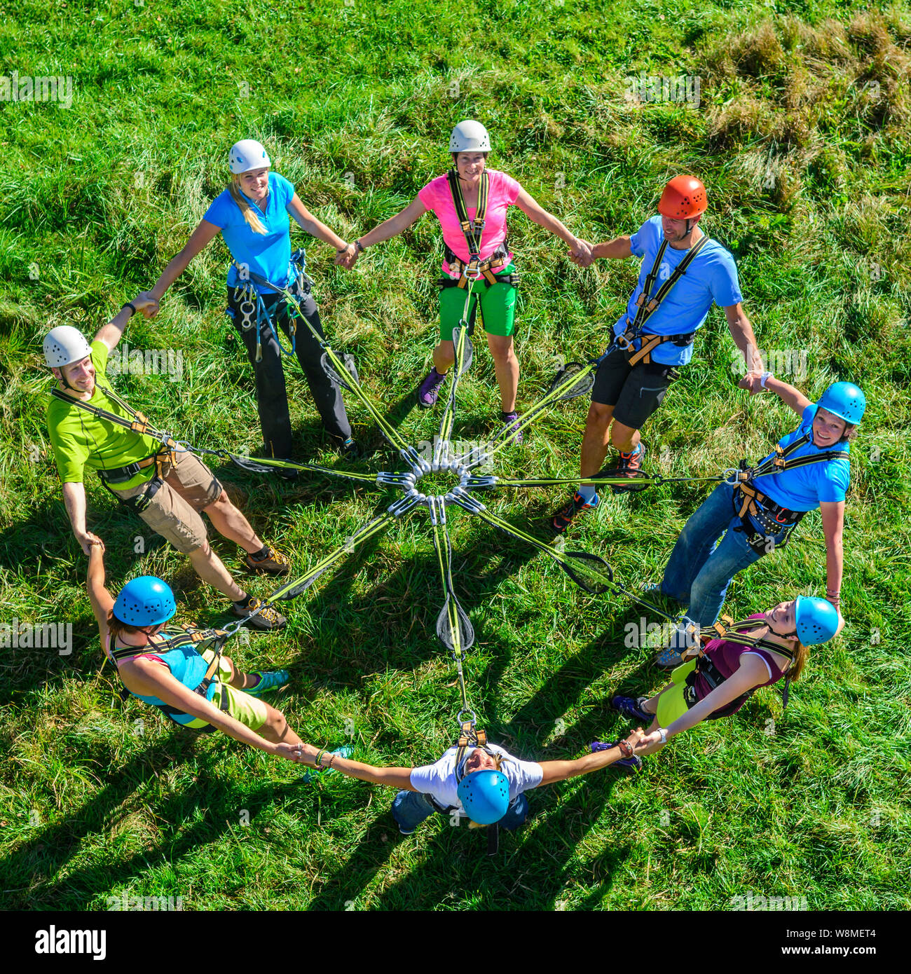 Group solidarity and team spirit in High Ropes Course Stock Photo
