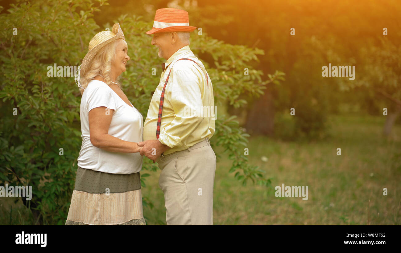 The Old Couple Near The Trees Stock Photo