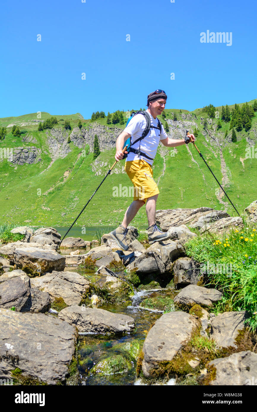 Man hiking in alpine region in austrian alps Stock Photo - Alamy