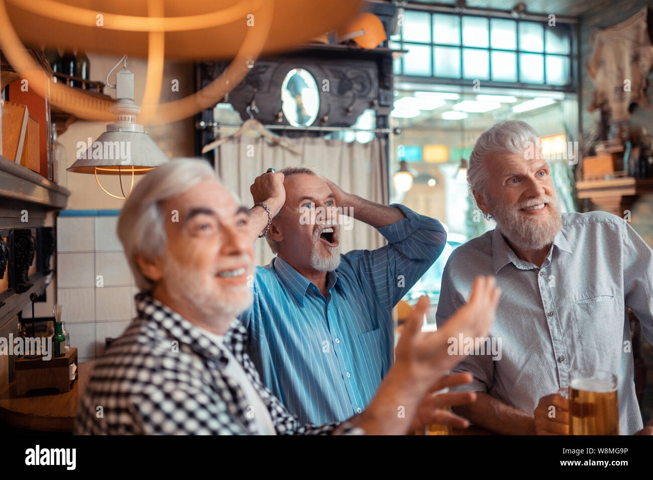Old man watching football hi-res stock photography and images - Alamy