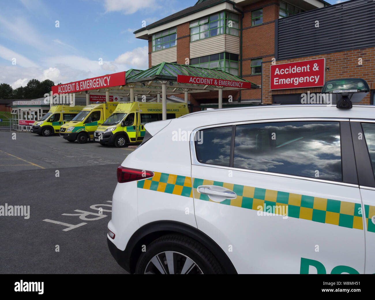 Doctors car at the A&E Dept, The Royal Bolton Hospital, with North West Ambulance Service vehicles, Bolton, Lancashire, Greater Manchester, England UK Stock Photo