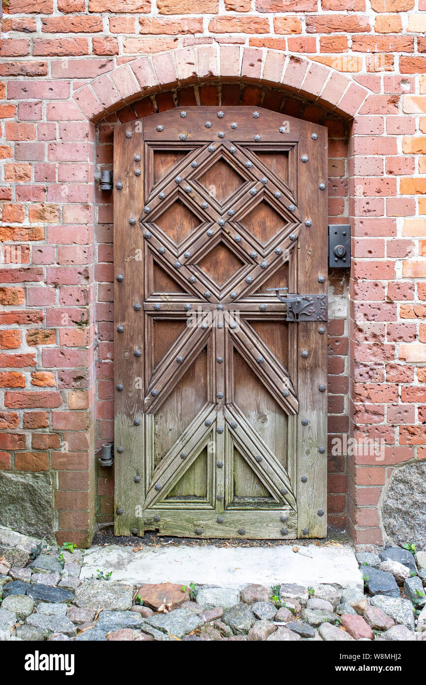 The gothic door in the medieval teutonic knights castle Malbork, Poland