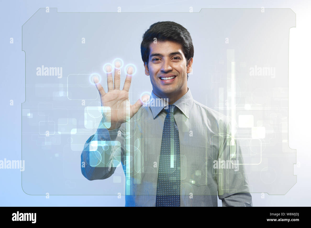 Businessman using a touch screen for biometrics identification Stock Photo
