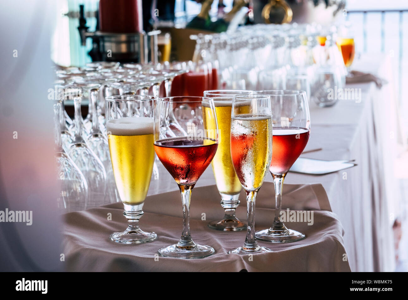 Set of coloured glasses at the restaurant with wines and. beer