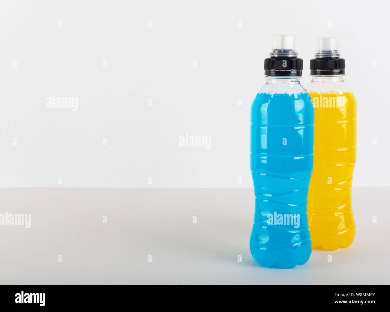 Isotonic Energy Drink Bottles With Blue And Yellow Transparent Liquid Sport Beverage On A White Background Stock Photo Alamy
