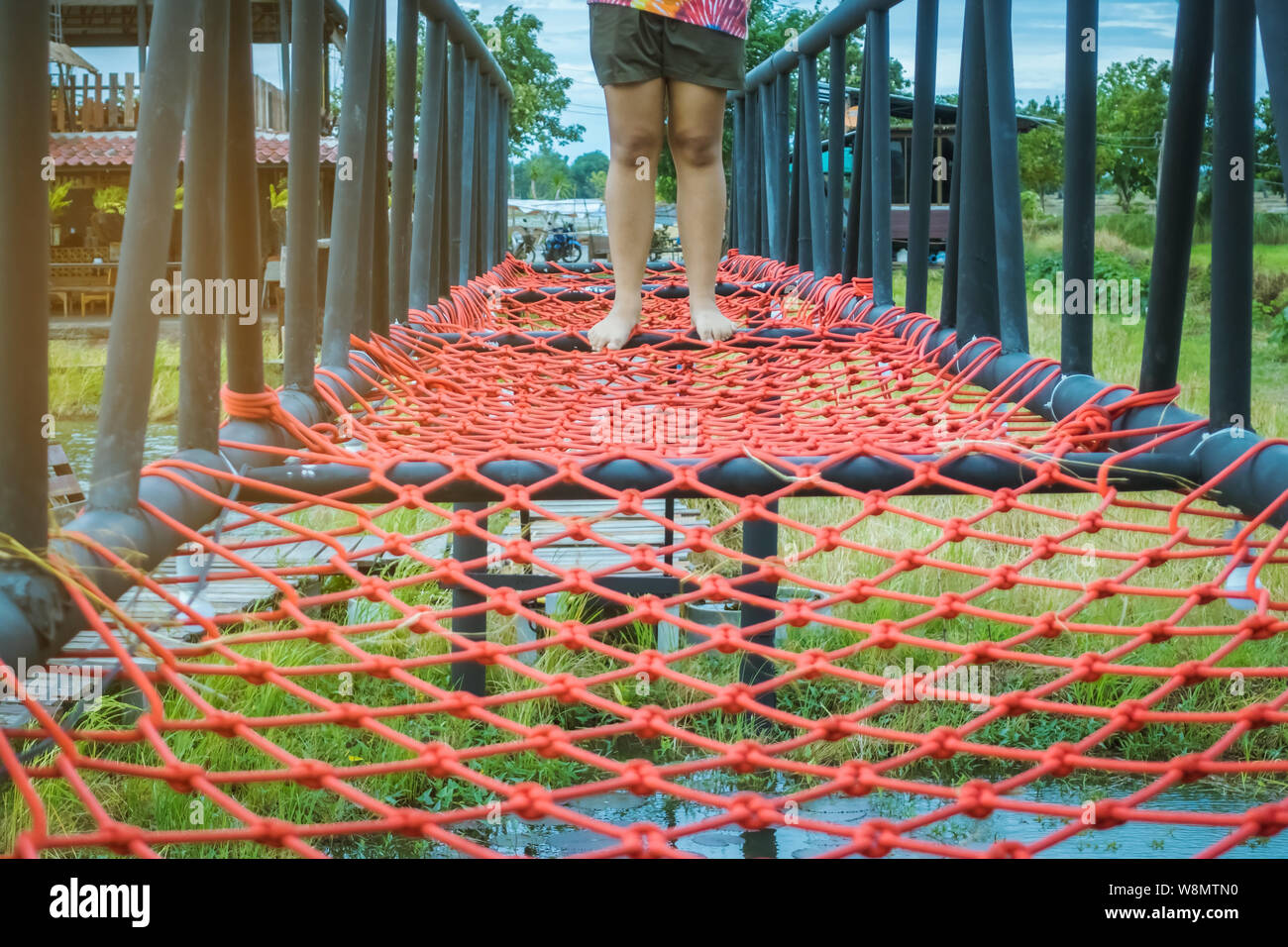 Swampy Rope Crossing the river on a climbing rope hi-res stock photography and ...