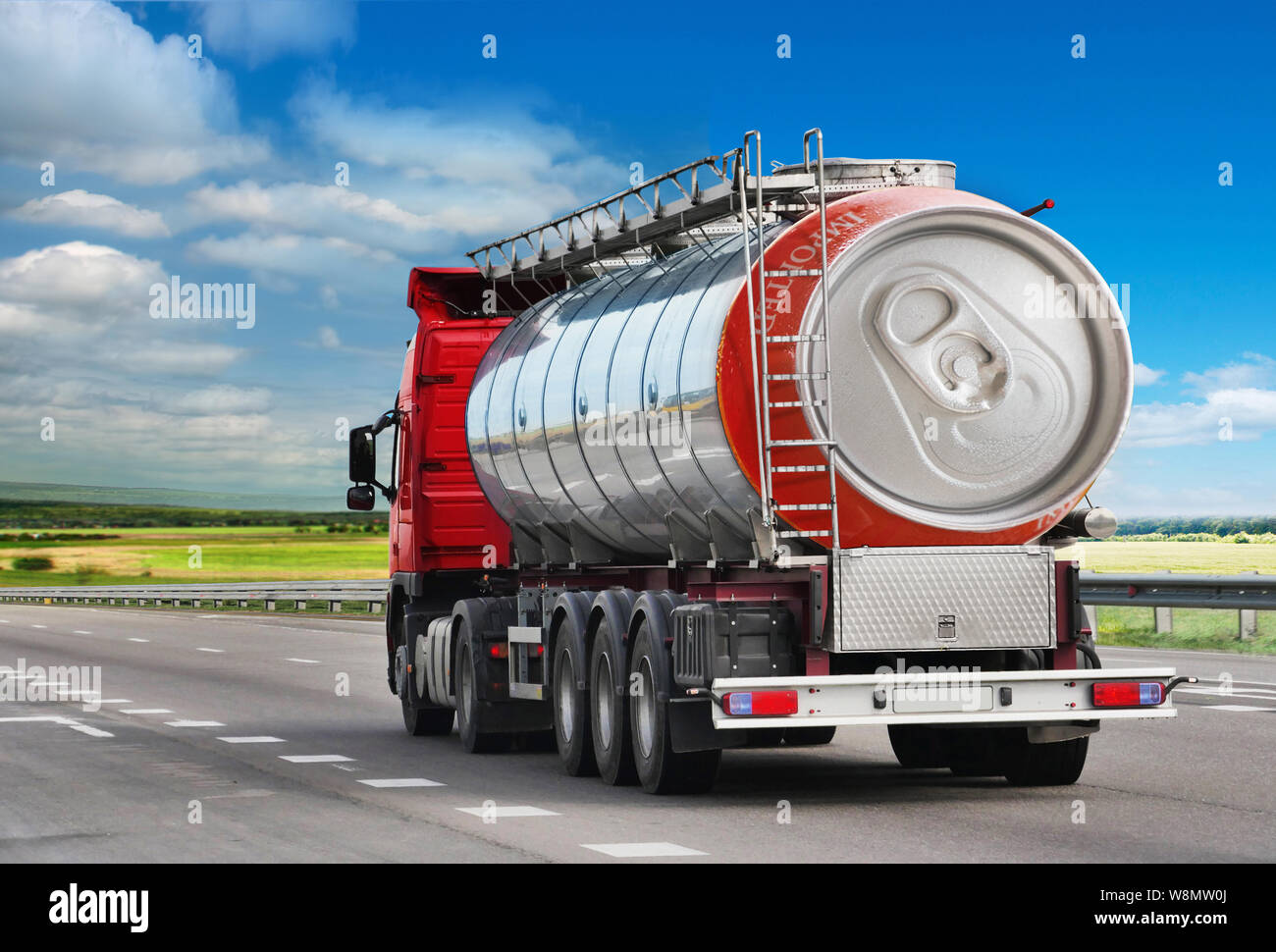 Tanker with chrome tanker on the highway. Fuel truck transports beer in a can. Conceptual idea Stock Photo