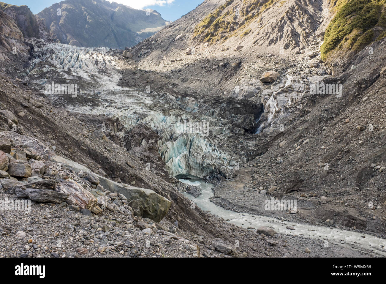 Hiking through the barren and rugged landscape that leads to the head of Franz Josef Glacier in New Zealand nobody in the image Stock Photo