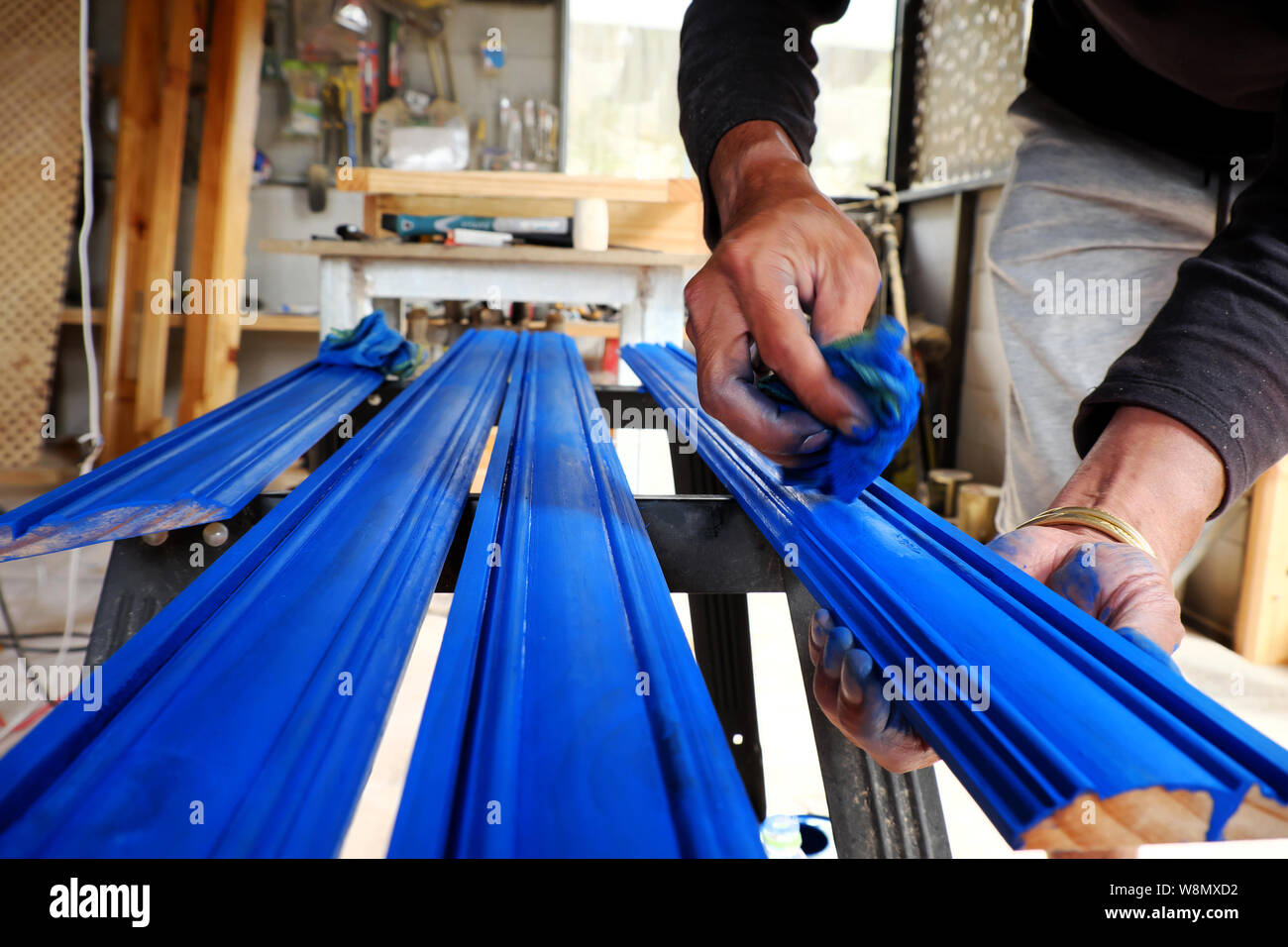 Vietnamese Man Working In Workshop Male Hands Painting On Wooden