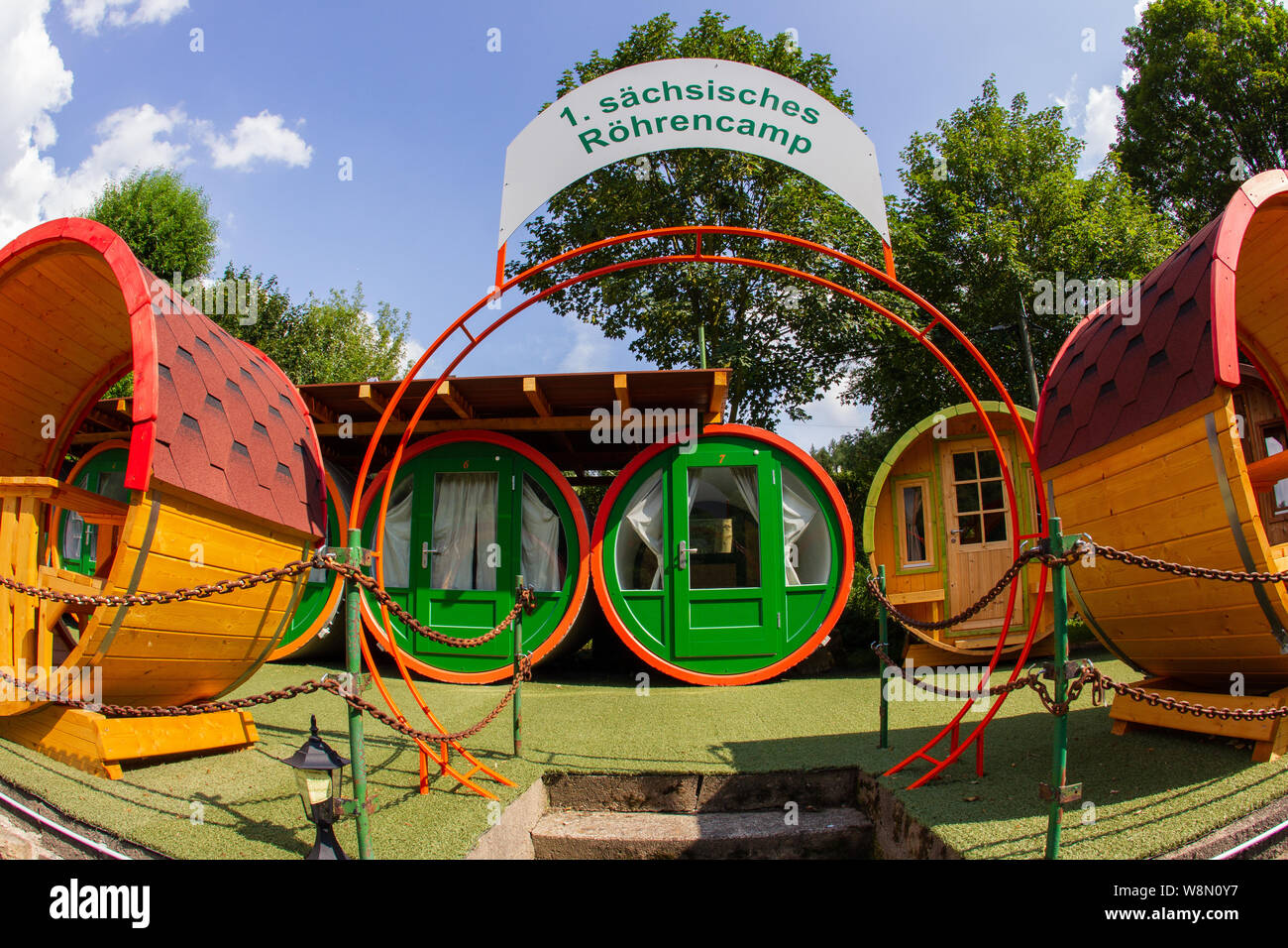 23 July 2019, Saxony, Knigstein: On the camping site at the Treidlerweg in  the Saxon Knigstein stands the 1st Saxon tube camp. The camp consists of  ten concrete and wooden tubes for