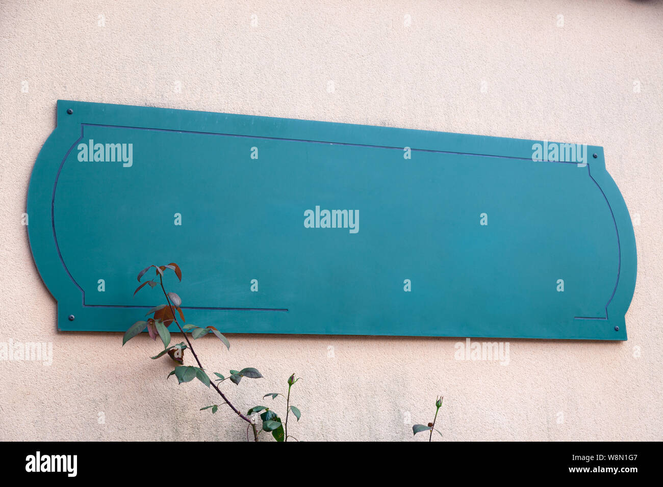 Empty sign on wall, green empty mockup plate with copyspace. Empty ...