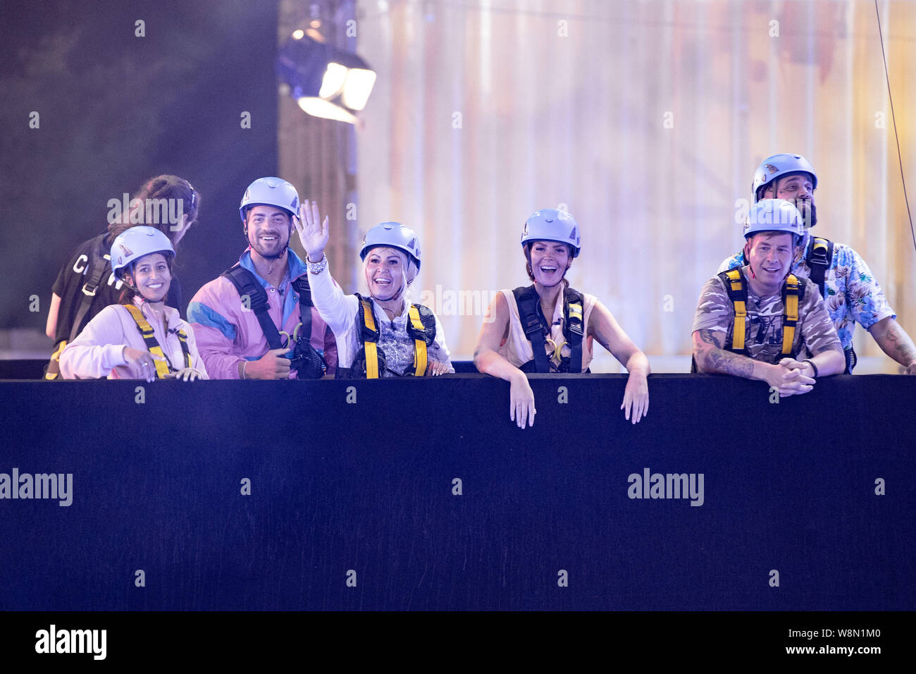 Cologne, Germany. 09th Aug, 2019. Eva Benetatou (l-r), Tobi Wegener, Ginger Costello Wollersheim, Janine Pink, Almklausi and Chris are on stage on a lift truck at the opening show of the new season of the Sat.1 reality show 'Promi Big Brother'. Credit: Marcel Kusch/dpa/Alamy Live News Stock Photo