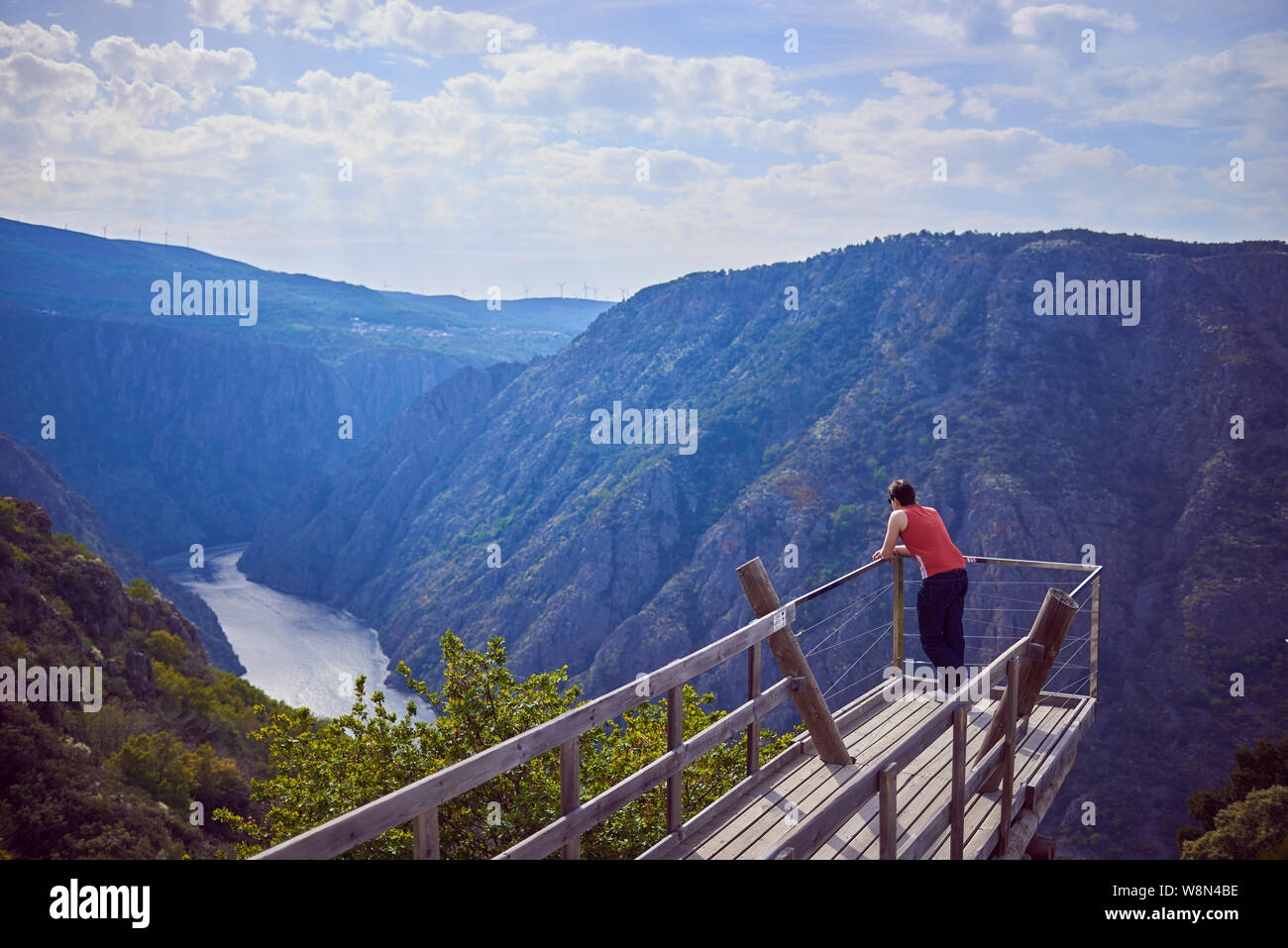 Young man contemplating the Sil Canyon from Xariñas do Castro viewpoint in Galicia, Spain Stock Photo