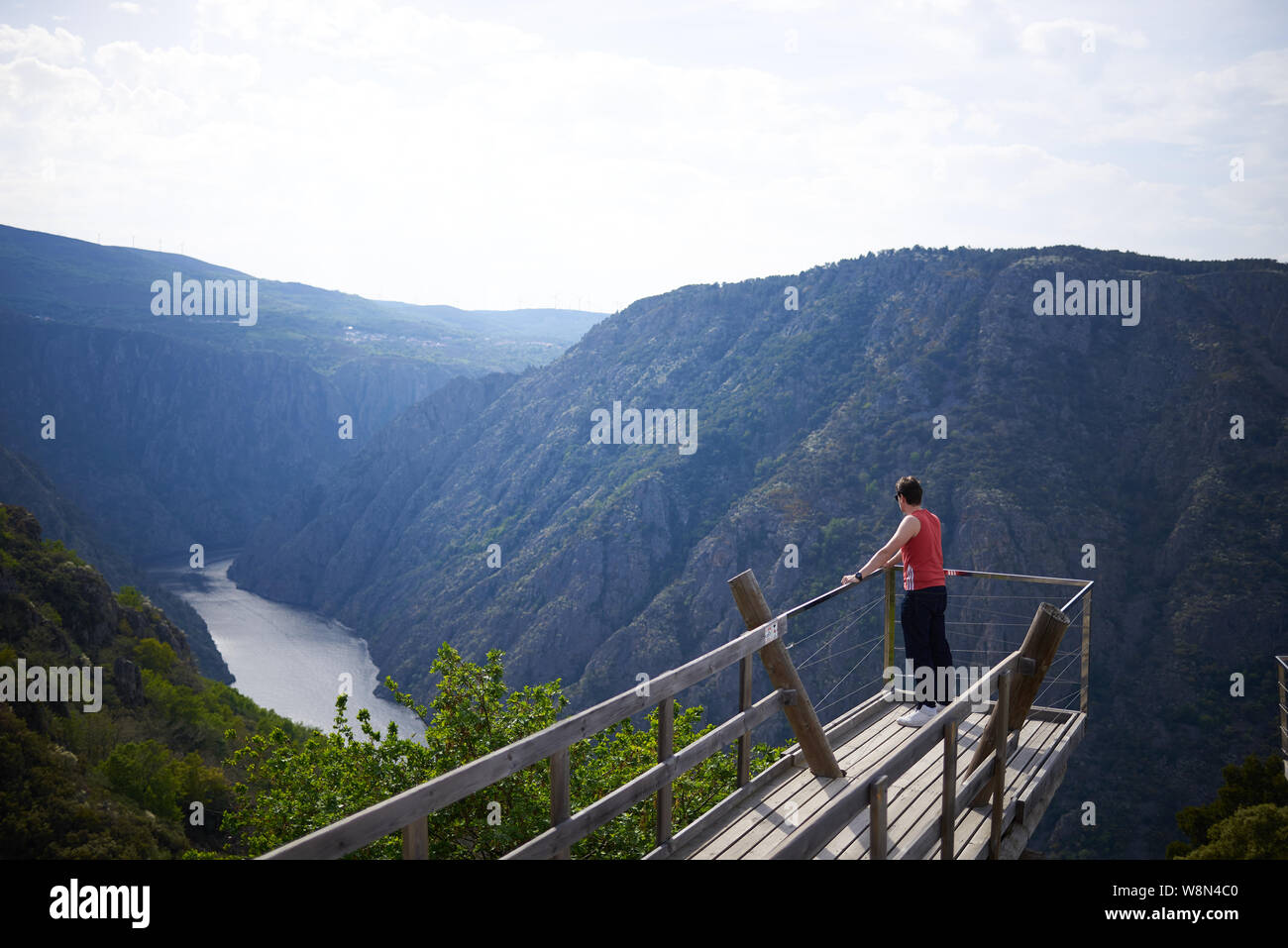 Young man contemplating the Sil Canyon from Xariñas do Castro viewpoint in Galicia, Spain Stock Photo