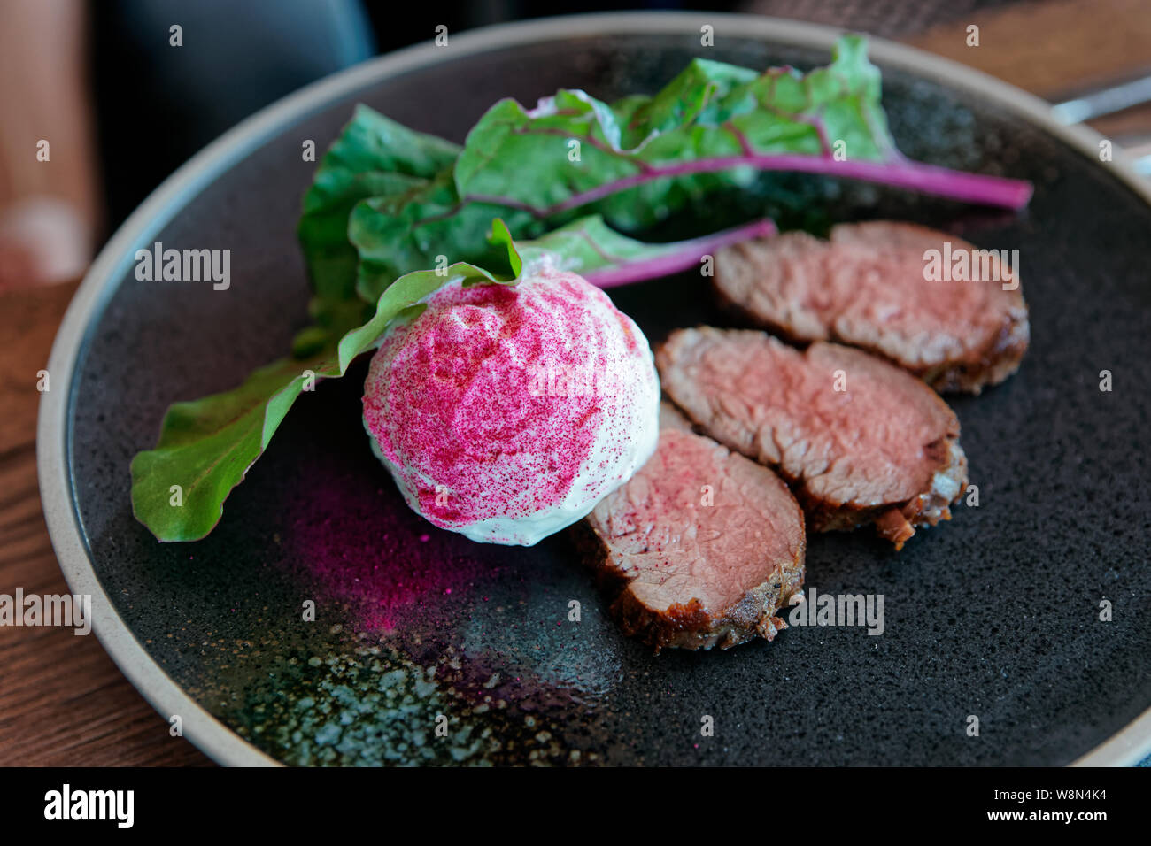 Roast beef with creamy horse-radish sauce on plate Stock Photo