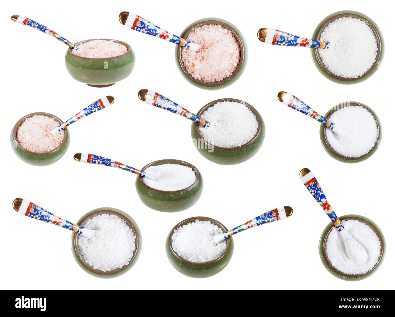 set from ceramic salt cellar with spoon with various salts isolated on white background Stock Photo