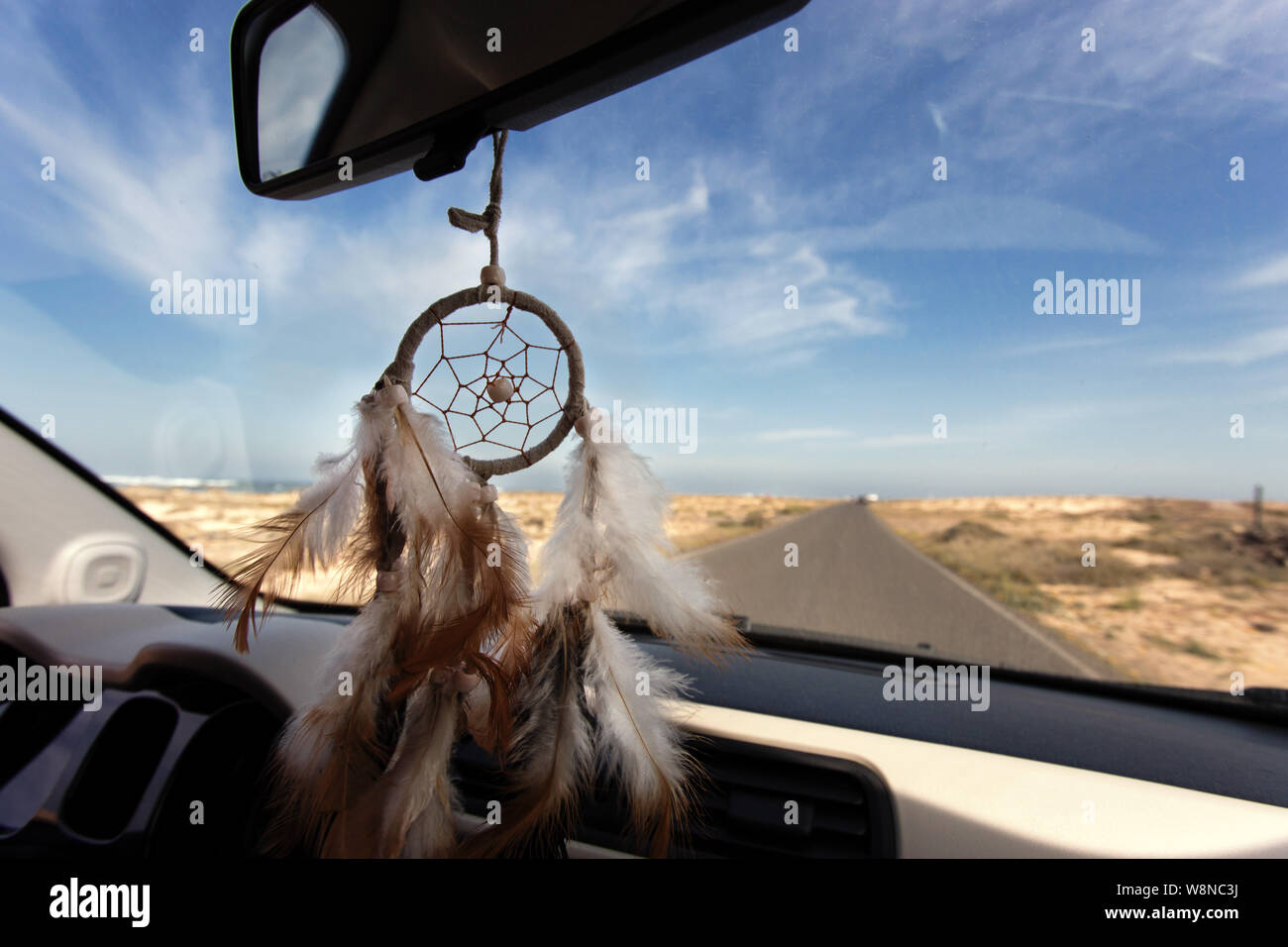 dreamcatcher in car for roadtrip on desert island Stock Photo Alamy