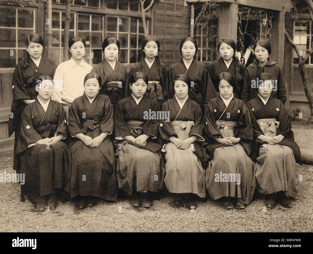 [ 1920s Japan - Japanese Girl’s High School ] —   Students of Miwada Girl’s High School (三輪田高等女學校) in Kudan-kita, Tokyo, 1928 (Showa 3). The school still exists and is now known as Miwada Gakuen (三輪田学園中学校).  The school was founded in Matsuyama, Shikoku, in 1880 (Meiji 13) by female educator Masako Miwada (1843-1927, 三輪田眞佐子), but moved to Tokyo in (1887 (Meiji 20). A scholar of the Chinese classics (漢学者), Miwada was among the first to promote education for girls.  20th century vintage gelatin silver print. Stock Photo