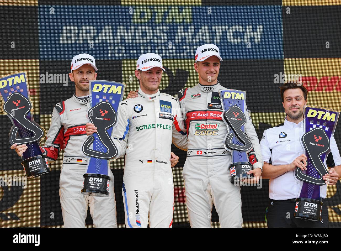KENT, UNITED KINGDOM. 10th Aug, 2019. Marco Wittmann (BMW Team RMG) (centre), René Rast (Audi Sport Team Rosberg) (left) and Nico Müller (Audi Sport Team Abt Sportsline) popped Champagne at Winners presentation after DTM Race 1 during DTM (German Touring Cars) and W Series at Brands Hatch GP Circuit on Saturday, August 10, 2019 in KENT, ENGLAND. Credit: Taka G Wu/Alamy Live News Stock Photo