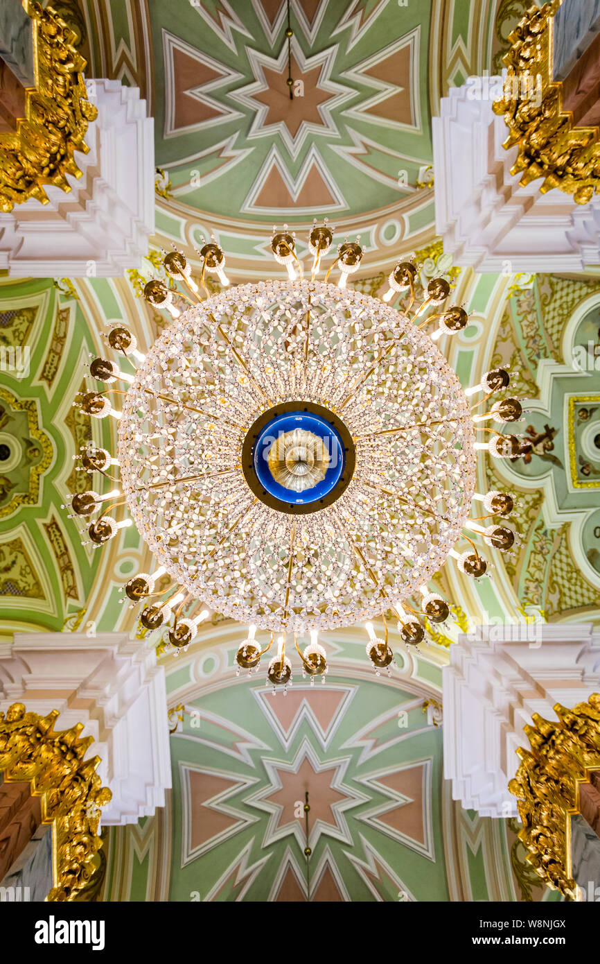 Looking up at an ornate chandelier inside the Peter and Paul cathedral in the Peter and Paul Fortress, St Petersburg, Russia on 22 July 2019 Stock Photo
