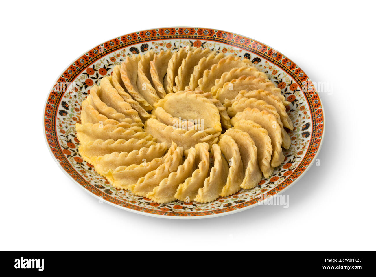 Dish with traditional festive Gazelle Horns cookies isolated on white background Stock Photo