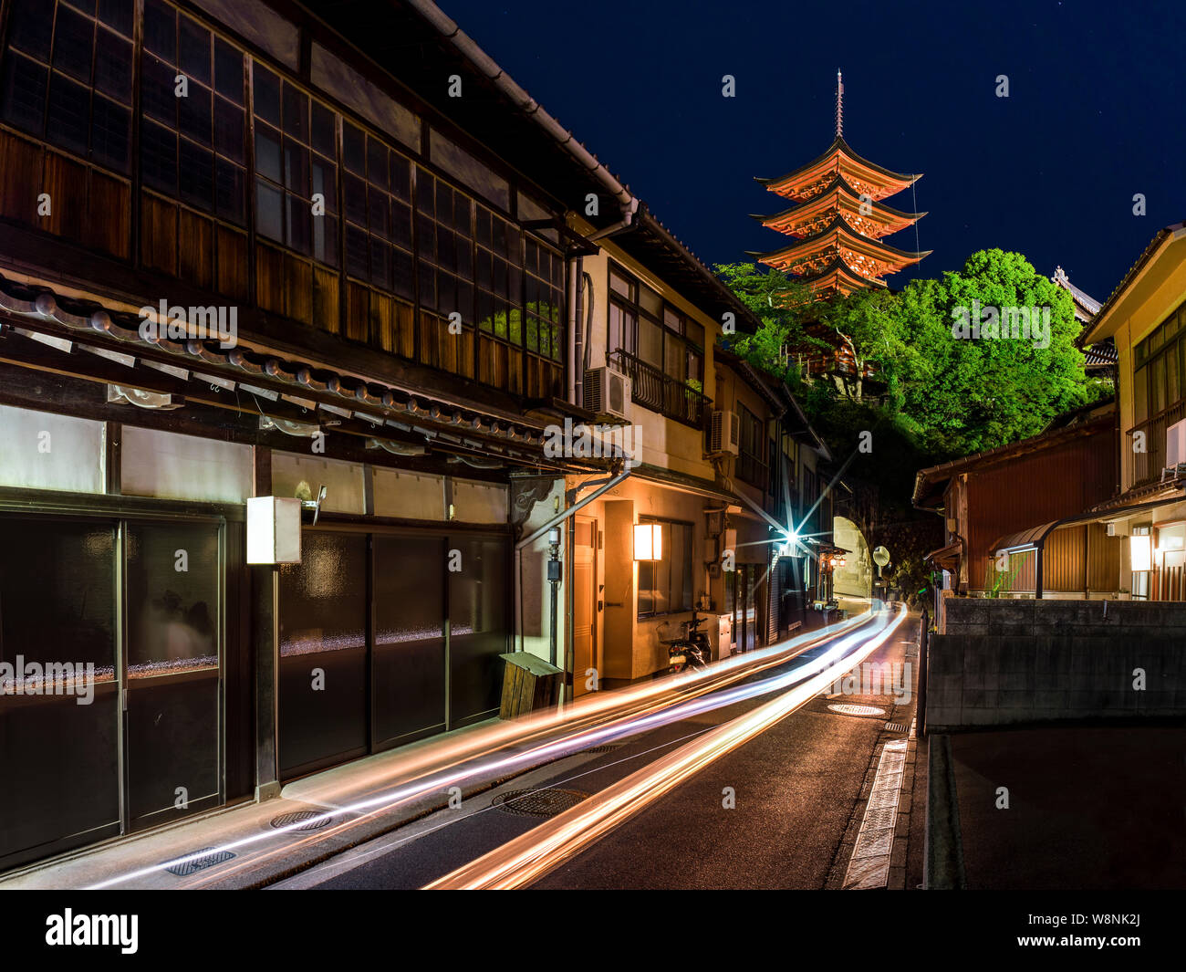 Light trails in Japan - traditional houses and tower Stock Photo