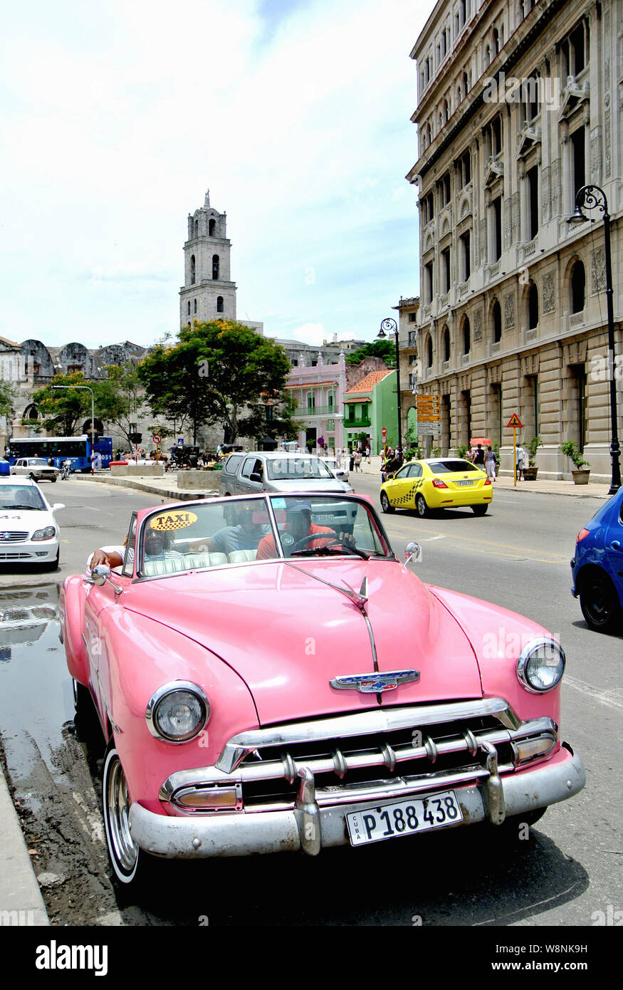 classic  chevy convertible  taxi picks up tourists Stock Photo