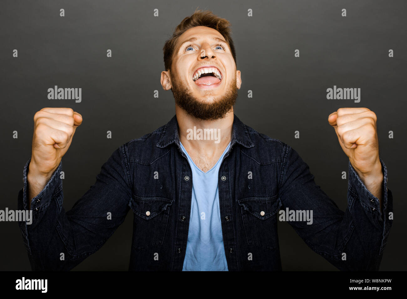 Modern young man cheering win hi-res stock photography and images - Alamy