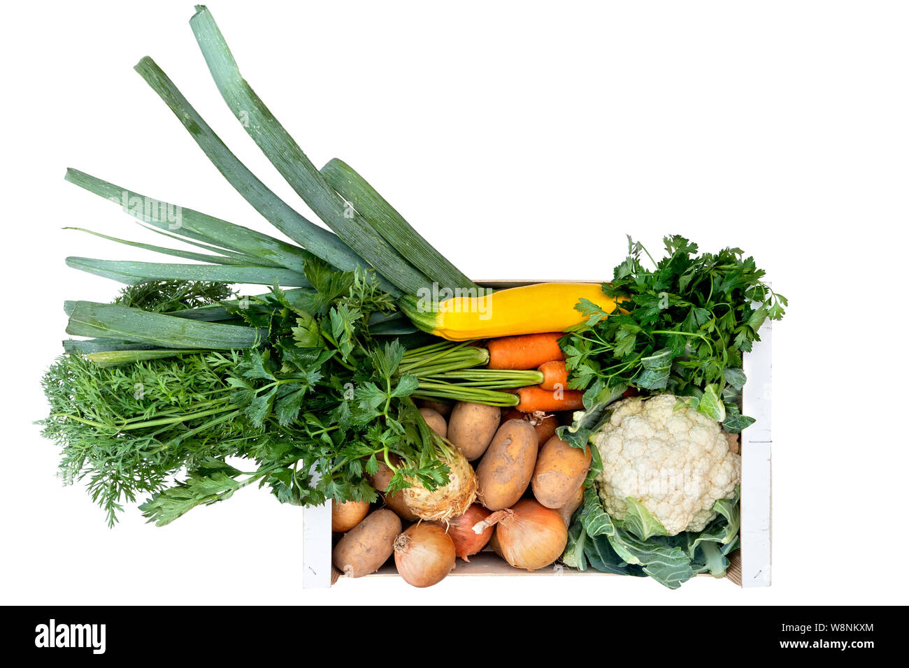 Wooden box of fresh vegetables from farmers market isolated on white ...