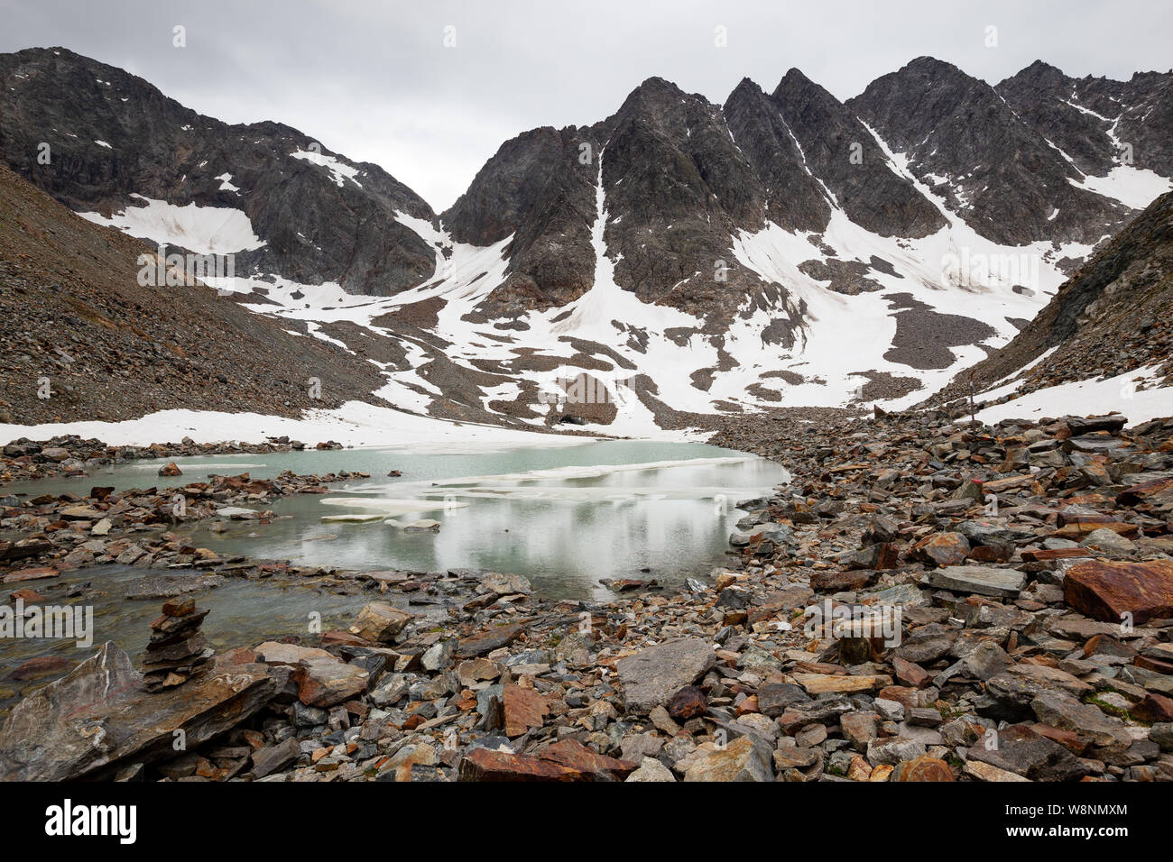 Klammerkopfe mountain peaks, glaciers and alpine lake, snow. Schobergruppe. Hohe Tauern National Park. Austrian Alps. Stock Photo