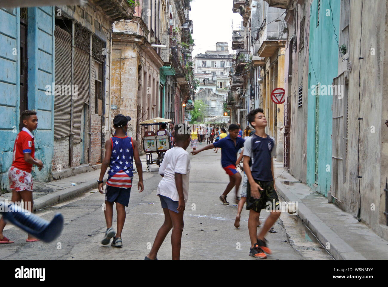 Kids playing soccer on havana street Stock Photo