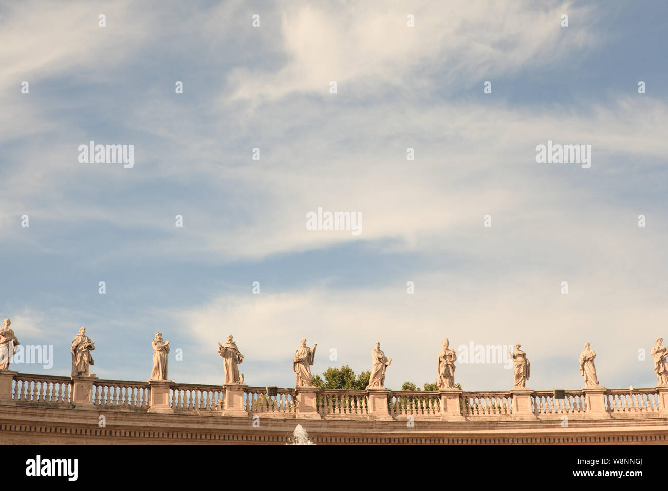 Statues on the top of st peters basilica hires stock photography and