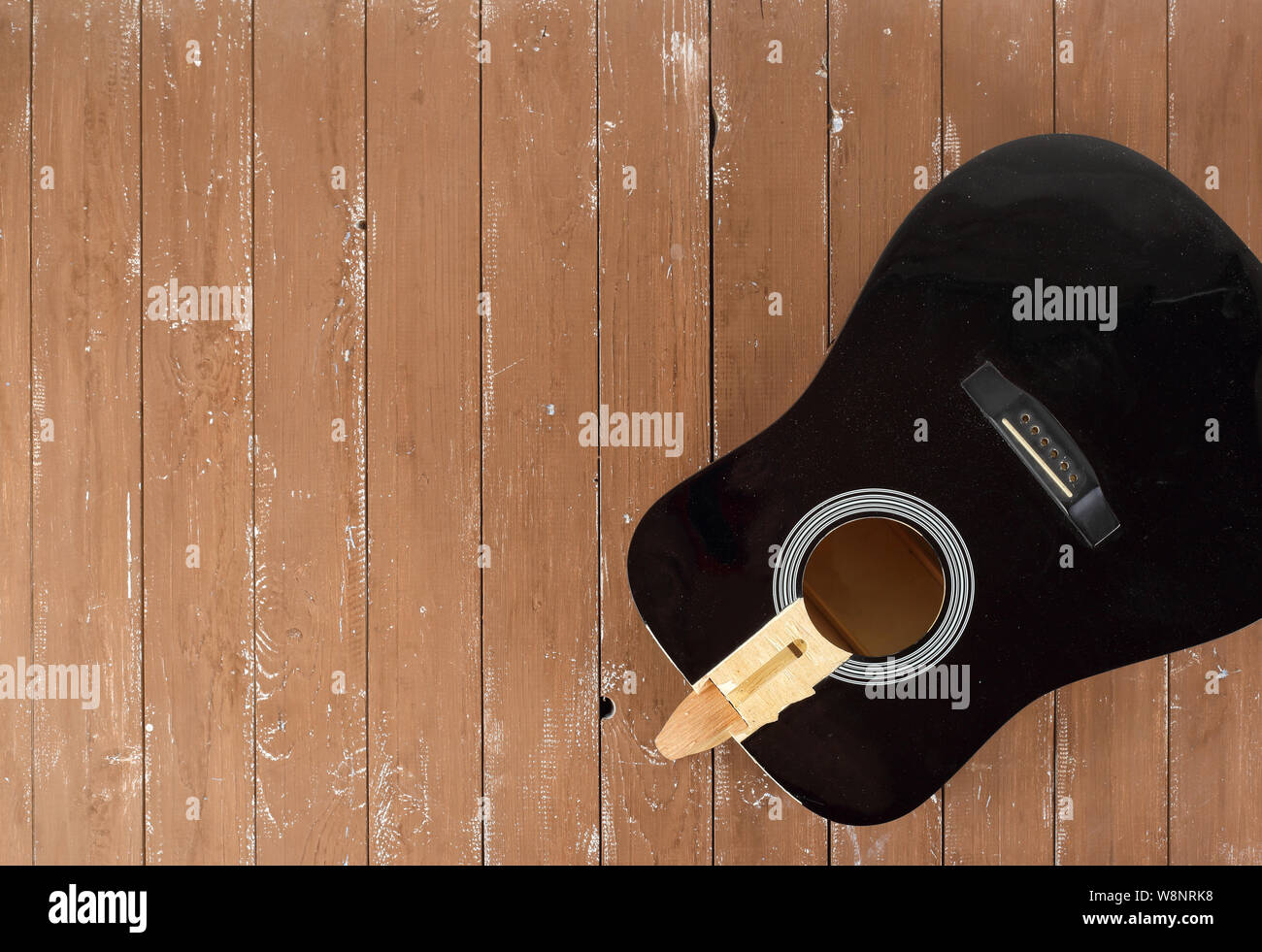 Guitar repair and service - broken sound board acoustic guitar top view wooden background Stock Photo